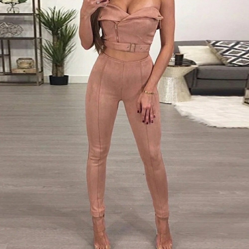 Two piece pink suede outfit.